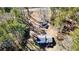 Aerial view showcasing the home's layout and wooded lot, emphasizing privacy and setting at 2248 Bethel Rd, Conyers, GA 30012
