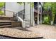 Multi-level backyard featuring a patio, stairs, and lush landscaping at 306 Pinecrest Ne Rd, Atlanta, GA 30342