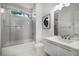 A bathroom with hexagon tile shower, glass doors, and a modern vanity at 306 Pinecrest Ne Rd, Atlanta, GA 30342