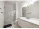 Bathroom with a glass door shower, white vanity, and modern fixtures at 306 Pinecrest Ne Rd, Atlanta, GA 30342
