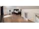 Upstairs bedroom featuring hardwood floors, sloped ceilings, and a cozy, comfortable space at 306 Pinecrest Ne Rd, Atlanta, GA 30342