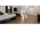 Bedroom featuring sloped ceilings, a black framed bed, and a view of the trees outside at 306 Pinecrest Ne Rd, Atlanta, GA 30342