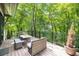 Outdoor deck with ample seating, ideal for enjoying the surrounding natural scenery and peaceful ambiance at 306 Pinecrest Ne Rd, Atlanta, GA 30342