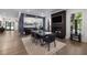 Open-concept dining room with a fireplace, bar, and a clear view of the beautiful surrounding landscape at 306 Pinecrest Ne Rd, Atlanta, GA 30342