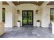 Stately front entrance with double doors, stone pillars, and dark gray tile at 306 Pinecrest Ne Rd, Atlanta, GA 30342