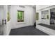 Modern gym with mirrored wall, rubber flooring, and a view of the outdoor living area at 306 Pinecrest Ne Rd, Atlanta, GA 30342