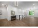 Spacious hallway with hardwood floors, recessed lighting, and metal railing at 306 Pinecrest Ne Rd, Atlanta, GA 30342