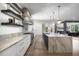 Open kitchen includes a marble island, stainless hood, and built-in stainless appliances at 306 Pinecrest Ne Rd, Atlanta, GA 30342