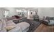 Large living room featuring hardwood floors, neutral furniture, and bright lighting at 306 Pinecrest Ne Rd, Atlanta, GA 30342