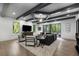 Bright living room with beamed ceilings, hardwood floors, and a cozy seating area, perfect for relaxation at 306 Pinecrest Ne Rd, Atlanta, GA 30342