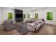 Spacious living room featuring large, comfortable seating and a built-in entertainment center at 306 Pinecrest Ne Rd, Atlanta, GA 30342