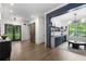 Open floor plan with hardwood floors leading to a bar and living room at 306 Pinecrest Ne Rd, Atlanta, GA 30342