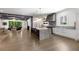 Open-concept living space with a gourmet kitchen, dining room, fireplace, and living room at 306 Pinecrest Ne Rd, Atlanta, GA 30342