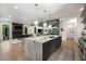 Modern living space features an open gourmet kitchen, dining room, and cozy fireplace at 306 Pinecrest Ne Rd, Atlanta, GA 30342