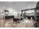Open concept living space, including a chef's kitchen, dining room, bar, and fireplace at 306 Pinecrest Ne Rd, Atlanta, GA 30342