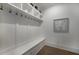 Mudroom featuring built-in storage bench with drawers, hooks, and shelving at 306 Pinecrest Ne Rd, Atlanta, GA 30342