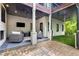 Spacious covered patio with outdoor seating, a ceiling fan, and a view of the backyard at 306 Pinecrest Ne Rd, Atlanta, GA 30342