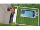 Aerial view of a private backyard oasis featuring a modern pool, spa, and lush green surroundings at 306 Pinecrest Ne Rd, Atlanta, GA 30342