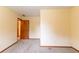 Bedroom featuring neutral walls, plush carpet, natural light, and a doorway slightly open at 3440 Quinn Ridge Dr, Snellville, GA 30039