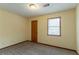 Bedroom showcasing tan walls, brown carpet, natural light, and a closet at 3440 Quinn Ridge Dr, Snellville, GA 30039