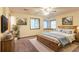 Comfortable bedroom features a ceiling fan, carpeted floors, and a cozy window nook with lots of natural light at 3440 Quinn Ridge Dr, Snellville, GA 30039