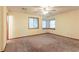Bedroom showing neutral walls, carpeted floors, and natural light from multiple windows at 3440 Quinn Ridge Dr, Snellville, GA 30039