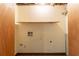 A functional laundry room with essential hookups and storage shelf is ready for appliances at 3440 Quinn Ridge Dr, Snellville, GA 30039