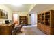Office space in basement includes an antique desk and book shelves at 3440 Quinn Ridge Dr, Snellville, GA 30039