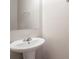 Simple bathroom with a pedestal sink and a large mirror at 3469 Stoneleigh Walk, Lithonia, GA 30038