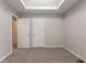 Bedroom with two closets and carpet floors featuring a skylight for natural light at 3469 Stoneleigh Walk, Lithonia, GA 30038