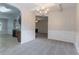 Elegant dining room featuring wainscoting, a chandelier, and access to the kitchen at 3469 Stoneleigh Walk, Lithonia, GA 30038