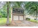 Charming two-story home features a brick facade and a convenient two-car garage at 3469 Stoneleigh Walk, Lithonia, GA 30038