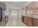 Functional kitchen features tiled floors, granite counters, and plenty of natural light at 3469 Stoneleigh Walk, Lithonia, GA 30038