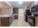 Spacious kitchen with granite countertops, plenty of storage, and modern appliances at 3469 Stoneleigh Walk, Lithonia, GA 30038