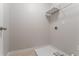 Compact laundry room with connections and wire shelving ready for appliances at 3469 Stoneleigh Walk, Lithonia, GA 30038