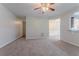 Inviting living room with neutral walls, carpet flooring, and an open doorway at 3469 Stoneleigh Walk, Lithonia, GA 30038