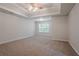 Expansive main bedroom with tray ceilings and plenty of natural light at 3469 Stoneleigh Walk, Lithonia, GA 30038