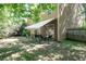 Enjoy outdoor living on the backyard patio, complete with retractable awning and privacy fence, accessible through sliding glass doors at 4003 Maple Ridge Nw Ln, Acworth, GA 30101