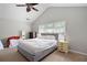 Cozy bedroom featuring a neutral color palette, a comfortable bed, and ample natural light from a window at 4003 Maple Ridge Nw Ln, Acworth, GA 30101