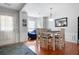 The dining room features hardwood floors, a table with seating, and plenty of natural light at 4003 Maple Ridge Nw Ln, Acworth, GA 30101