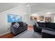 Open-concept living area with access to the kitchen, hardwood floors, and cozy sofas at 4003 Maple Ridge Nw Ln, Acworth, GA 30101