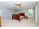 Bedroom with bare floors, light-grey walls, natural light, and traditional ceiling fan at 567 Leah Drive, Powder Springs, GA 30127