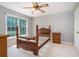 Bedroom with large windows providing natural light and a ceiling fan at 567 Leah Drive, Powder Springs, GA 30127