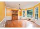 Dining room featuring yellow walls, hardwood floors, and large windows at 567 Leah Drive, Powder Springs, GA 30127