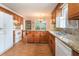 Well-appointed kitchen with granite countertops, wood cabinetry, and stainless appliances at 567 Leah Drive, Powder Springs, GA 30127