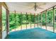 Spacious screened porch providing an airy and refreshing outdoor living space with views of lush greenery at 567 Leah Drive, Powder Springs, GA 30127