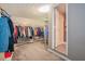 Expansive walk-in closet with multiple hanging racks and rods maximizing storage and organization at 567 Leah Drive, Powder Springs, GA 30127