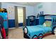 Whimsical bedroom with a blue train-themed bed and playful decor at 735 Sweethaven Ln, Loganville, GA 30052