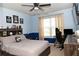 Bedroom featuring a bed, TV, desk, and personal touches, creating a cozy and personalized space at 735 Sweethaven Ln, Loganville, GA 30052