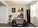 Dining room with modern table, seating for four, and stylish decor at 735 Sweethaven Ln, Loganville, GA 30052